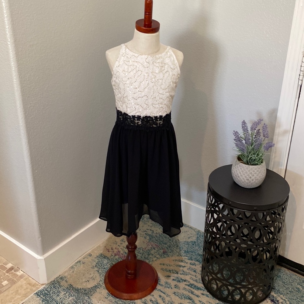 Very cute black and white dress beaded but super soft.  Not itchy at all!!